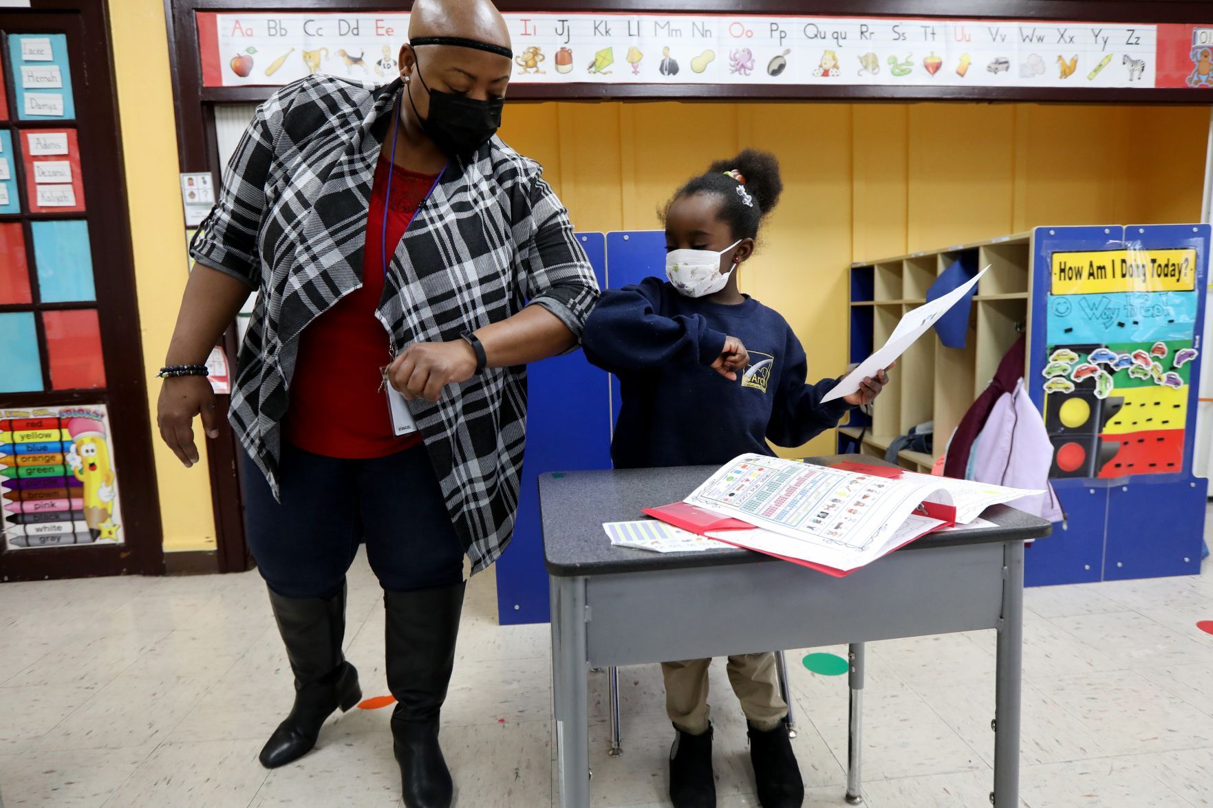 Elbow bumps of praise with Principal Tanisha Stanciel